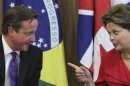 Britain's PM Cameron talks with Brazil's President Rousseff during a ceremony at the Planalto Palace in Brasilia