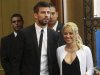 Colombian pop star and United Nations Children's Fund ambassador, Shakira, walks with her boyfriend Gerard Pique, after her joint news conference with Israel's president Peres at 3rd annual Israeli Presidential Conference in Jerusalem