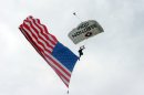 A professional skydiver swoops to the ground at the Constitution Center during a Flag Day celebration, Friday, June 14, 2013, in Philadelphia. (AP Photo/Keith Collins)