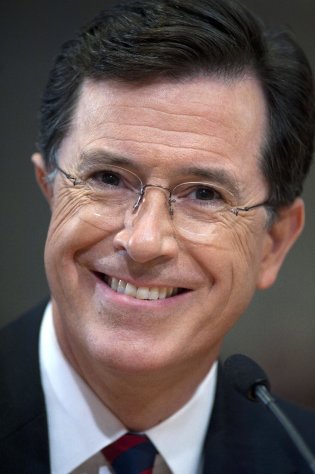 FILE- This Thursday, June 30, 2011 file photo shows comedian Stephen Colbert as he appears before the Federal Election Commission in Washington. Comedy Central's "Colbert Report" is currently off the air. An expected live version of the show was replaced by a repeat on Wednesday. Comedy Central said Thursday's live show will be off, too. The network said it was airing the repeats "due to unforeseen circumstances," but offered no other explanation. (AP Photo/Cliff Owen, File)
