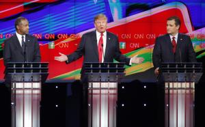 Donald Trump, center, speaks as Ben Carson, left, and …