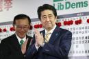 Japan's Prime Minister Abe claps during an election night event at the LDP headquarters in Tokyo