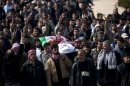 People carry Abdulaziz Abu Ahmed Khrer, killed by a Syrian Army sniper, during his funeral in Idlib, north Syria, Thursday, March 8, 2012. (AP Photo/Rodrigo Abd)