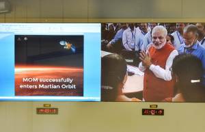 Indian Prime Minister Narendra Modi is seen on a screen&nbsp;&hellip;