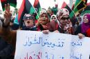 Libyan supporters of "Fajr Libya" protest in Tripoli on February 20, 2015, against recent Egyptian air strikes on Islamic State group bases in the east and against deadly car bombings that targeted the town of Al-Qoba earlier that day
