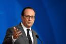 French President Francois Hollande holds a press conference at the EU headquarters in Brussels on October 15, 2015