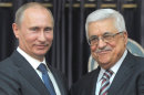 Russian President Vladimir Putin, left, and Palestinian President Mahmoud Abbas, right, shake hands during a media briefing following their meeting, in the West Bank town of Bethlehem, Tuesday, June 26, 2012. Visiting Russian President Vladimir Putin praised his Palestinian counterpart Tuesday for what he said was a "responsible" position in negotiations with Israel, frozen for nearly four years, and said Russia has no problem recognizing a Palestinian state. (AP Photo/RIA Novosti, Alexei Druzhinin, Presidential Press Service)