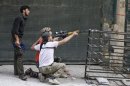 Free Syrian Army fighters take position in Aleppo's Bustan al-Basha district
