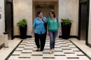 Fabiola Brana, left and her daughter Astrid Brana walk through Hotel Cohiba where they are staying in Havana, Cuba, Wednesday March 28, 2012. The two are part of a delegation of more than 300 mostly Cuban-American pilgrims visiting the island in honor of Pope Benedict XVI's visit. Fabiola Brana was born in Cuba and left when she was 16-years-old. Both live in Miami. (AP Photo/Franklin Reyes)