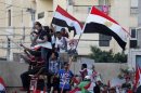 Protesters who are against ousted Egyptian President Mursi celebrate in Alexandria