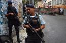 Policemen patrol a favela neighborhood in Rio de Janeiro, Brazil, on April 24, 2014