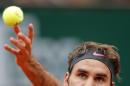 Switzerland's Roger Federer serves the ball to France's Gael Monfils during their fourth round match of the French Open tennis tournament at the Roland Garros stadium, Sunday, May 31, 2015 in Paris. (AP Photo/Francois Mori)