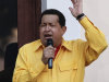 Venezuela's President Hugo Chavez sings on a balcony of Miraflores presidential palace in Caracas, Venezuela, Thursday, July 28, 2011. Chavez sang on a balcony of the presidential palace as he celebrated his 57th birthday before a crowd of supporters, vowing to overcome cancer. (AP Photo/Ariana Cubillos)