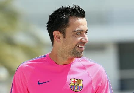 FC Barcelona&#39;s player Xavi Hernandez smiles before news conference at Joan Gamper training camp