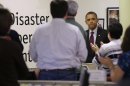 President Barack Obama receives applauds by workers during the his visit to the Disaster Operation Center of the Red Cross National Headquarter to discuss superstorm Sandy, Tuesday, Oct. 30, 2012, in Washington. (AP Photo/Pablo Martinez Monsivais)