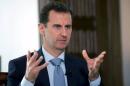 File photo of Syria's President Bashar al-Assad speaking during an interview with Russia's RIA new agency