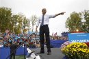 U.S. President Barack Obama points to the crowd during a campaign rally at George Mason University in Fairfax