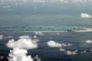 A photo taken from a military aircraft shows alleged on-going reclamation by China on Mischief Reef in the flashpoint Spratly Islands in the South China Sea