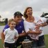 Justin Rose, of England, poses with his family and the Gene Sarazen Cup for after he won the Cadillac Championship golf tournament on Sunday, March 11, 2012, in Doral, Fla. To the left is Leo, 3; to the right his wife, Charlotte, holding 2-month-old Kate. (AP Photo/Wilfredo Lee)