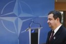 Serbian Prime Minister Ivica Dacic arrives at NATO headquarters after a meeting in Brussels