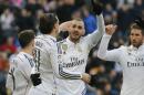 Real Madrid's Karim Benzema, center, celebrates after he scored during a Spanish La Liga soccer match between Real Madrid and Real Sociedad at the Santiago Bernabeu stadium in Madrid, Spain, Saturday Jan. 31, 2015. (AP Photo/Paul White)