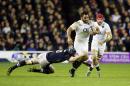 England's Billy Vunipola breaks through the Scotland line during the Six Nations rugby tournament match between Scotland and England, at Murrayfield Stadium, in Edinburgh, Scotland, Saturday, Feb. 6, 2016. (Danny Lawson/PA via AP) UNITED KINGDOM OUT