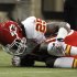 Kansas City Chiefs running back Jamaal Charles (25) grabs his leg after being injured on a play in the first quarter of an NFL football game against the Detroit Lions in Detroit, Sunday, Sept. 18, 2011. (AP Photo/Rick Osentoski)