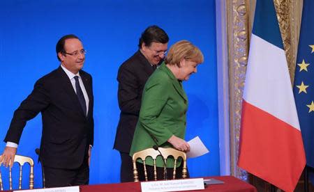 French President Hollande, German Chancellor Merkel, European Commission President Barroso attend a news conference at the end of an international summit on youth unemployment at the Elysee Palace in Paris