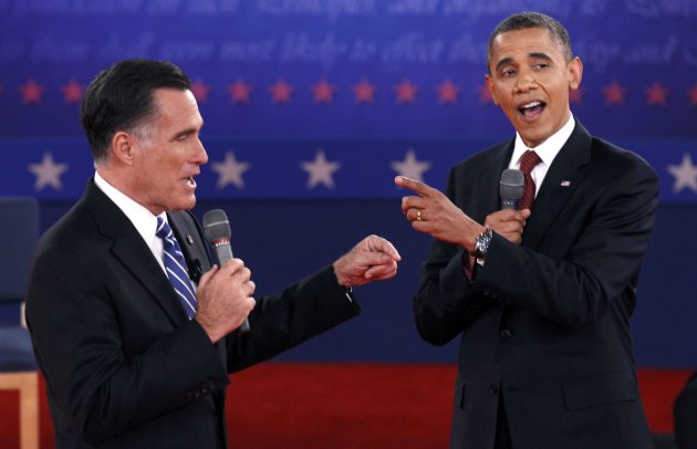 U.S. Republican presidential nominee Mitt Romney (L) and U.S. President Barack Obama answer a question at the same time during the second U.S. presidential campaign debate in Hempstead, New York, October 16, 2012. REUTERS/Jim Young (UNITED STATES  - Tags: POLITICS ELECTIONS USA PRESIDENTIAL ELECTION)
