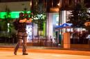 A policeman secures the area around the shopping mall Olympia Einkaufzentrum OEZ in Munich