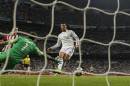 Real's Cristiano Ronaldo, right, scores his second goal during a Spanish La Liga soccer match between Real Madrid and Athletic Bilbao at the Santiago Bernabeu stadium in Madrid, Spain, Sunday, Oct. 5, 2014. (AP Photo/Andres Kudacki)