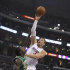 Los Angeles Clippers' Blake Griffin, right,  goes to the basket over Boston Celtics forward Brandon Bass in the first half of an NBA basketball game in Los Angeles on Monday, March 12, 2012.  (AP Photo/Christine Cotter)