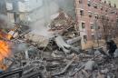 Searchers dig through rubble of 2 NY buildings