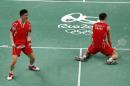 China's Fu Haifeng, left, and his teammate Zhang Nan celebrate after defeating Great Britain Marcus Ellis and Chris Langridge during the men's double semi-finals at the 2016 Summer Olympics in Rio de Janeiro, Brazil, Tuesday, Aug. 16, 2016. (AP Photo/Vincent Thian)