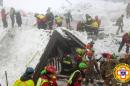Rescue workers search around the Hotel Rigopiano in Farindola, central Italy