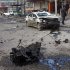 Security forces inspect the scene of a car bomb attack in Sadr City eastern of Baghdad, Iraq, Tuesday, Jan. 24, 2012. Two separate car bombs exploded in the Shiite district of Sadr City killing and wounding several people, police said. (AP Photo/Karim Kadim)