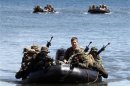 Philippine and U.S. marines sit in rubber dinghies during an amphibious raid as part of a Philippine-U.S. joint military exercise in Ulugan bay