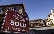 <p>               Home builder Toll Brothers' town homes are offered for sale at the Vistas at Indian Oak community in Chatsworth, Calif., on Monday, Dec. 5, 2011. Toll Brothers Inc. said Tuesday, Dec. 6, 2011, its fiscal fourth-quarter net income slid 70 percent, partly because last year's quarter was helped by a large tax benefit. (AP Photo/Damian Dovarganes)