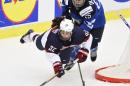 US player Dana Trivigno, left, in action against Finland's Suvi Ollikainen during the 2015 IIHF Ice Hockey Women's World Championship group A match between USA and Finland at Malmo Isstadion in Malmo, southern Sweden, on Sunday March 29, 2015. (AP Photo/Claudio Bresciani, TT) SWEDEN OUT