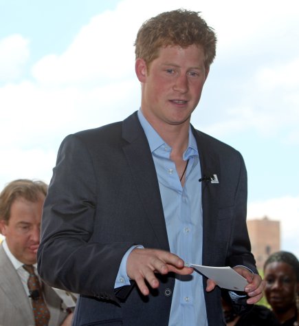 FILE - In this file photo taken Saturday May 30, 2009, Britain's Prince Harry addresses guests at the second annual Veuve Clicquot Manhattan Polo Classic polo match on Governor's Island in New York. The Prince sipped a Corona during a Cirque du Soleil show in Las Vegas over the Nov. 19-20, 2011, trip and rented a Harley. The British royal made a low-key appearance at a Scottsdale, Ariz., dealership on Friday, Nov.18, 2011.The vacation came as the prince is training on helicopters at an Air Force site near Gila Bend, Ariz. (AP Photo/David Goldman, File)