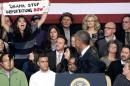 Obama takes on hecklers over immigration policy