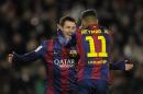 FC Barcelona's Lionel Messi, from Argentina, left, reacts after scoring with his teammate Neymar, from Brazil, during a Spanish La Liga soccer match against Espanyol at the Camp Nou stadium in Barcelona, Spain, Sunday, Dec. 7, 2014. (AP Photo/Manu Fernandez)