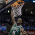 Boston Celtics forward Kevin Garnett (5) goes up for a dunk in front of Oklahoma City Thunder guard James Harden in the second quarter of an NBA basketball game in Oklahoma City, Wednesday, Feb. 22, 2012. (AP Photo/Sue Ogrocki)