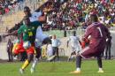 Cameroon's player Vincent Aboubacar (L) shoots against Mauritania goalkeeper Ibrahim Soulyemane (R) on June 14, 2015 at the Mamadou Ahidjo stadium in Yaounde during their 2017 African Cup of Nations qualification match