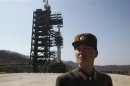 File photo of a soldier in front of a rocket sitting on a launch pad at the West Sea Satellite Launch Site, northwest of Pyongyang