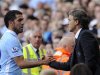 Manchester City's coach Mancini substitutes Tevez during their English Premier League soccer match against Wigan Athletic in Manchester