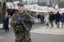 A French soldier patrols the Christmas market on the Champs Elysees in Paris as part of the "Vigipirate" security plan