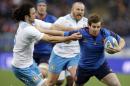 France's Camille Lopez, right, is tackled by Italy's Luke McLean during a Six Nations rugby union match between Italy and France, at Rome's Olympic Stadium, Sunday, March 15, 2015. (AP Photo/Andrew Medichini)