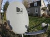 This photo made with a fisheye lens on Nov. 2, 2011, shows a DirecTv satellite dish on a post in the front yard of a home in Harmony, Pa. Satellite TV provider DirecTV said Thursday, Nov. 3, 2011, it raked in more subscribers than ever in the third quarter, helped by the NFL Sunday Ticket. (AP Photo/Keith Srakocic)