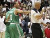Boston Celtics' Avery Bradley, center, puts his arm around Rajon Rondo, rear left, and walks him off the court as he is ejected from the game by referee Marc Davis late in the fourth quarter of Game 1 of a first-round NBA basketball playoff series against the Atlanta Hawks, Sunday, April 29, 2012, in Atlanta. The Hawks won 83-74. (AP Photo/Atlanta Journal-Constitution, Curtis Compton)  MARIETTA DAILY OUT; GWINNETT DAILY POST OUT